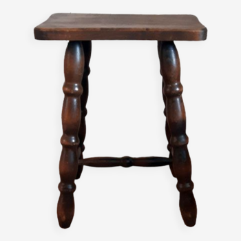 Brown turned wooden stool.