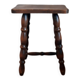 Brown turned wooden stool.