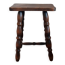 Brown turned wooden stool.