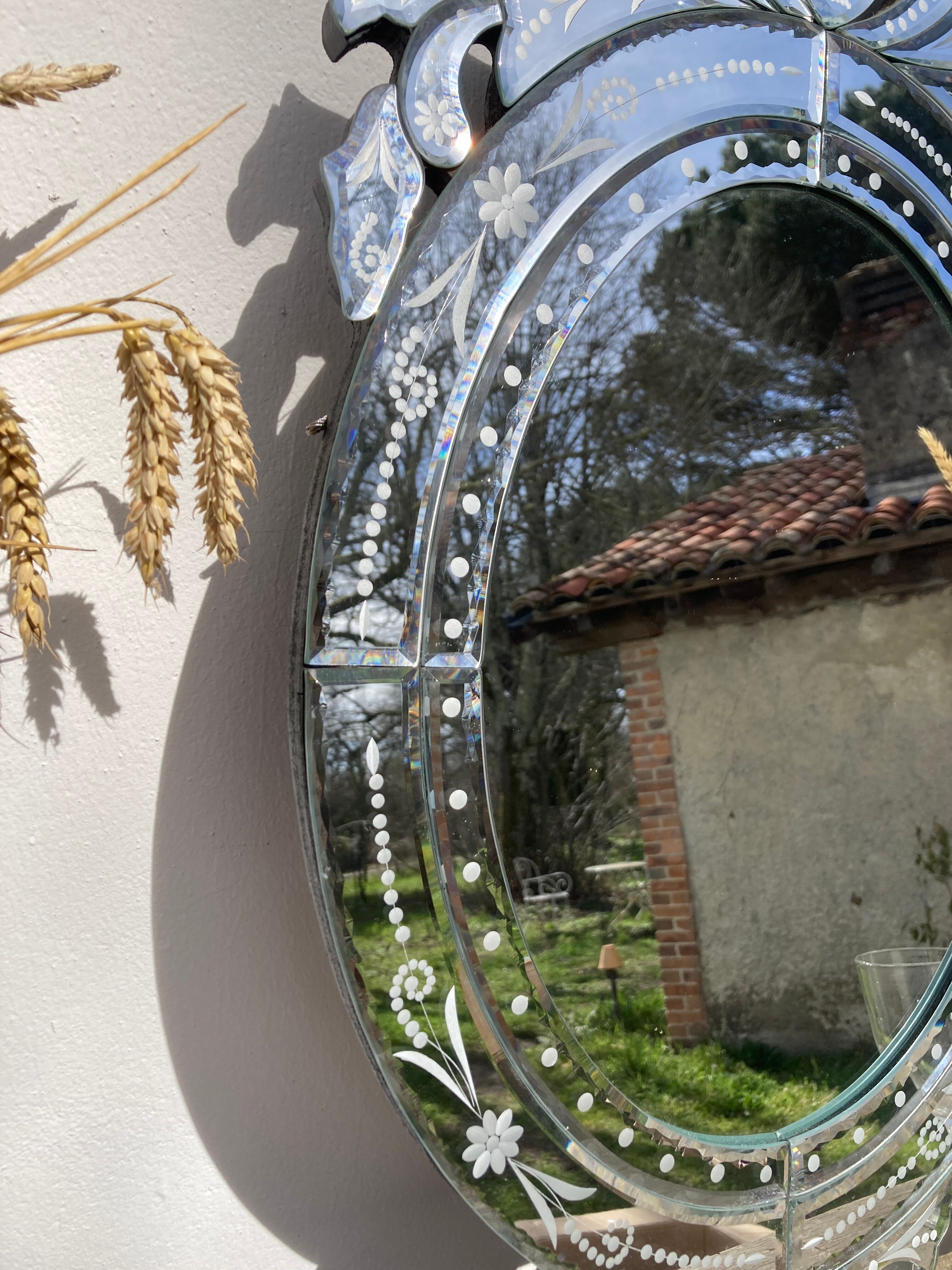 Oval Venetian wall mirror