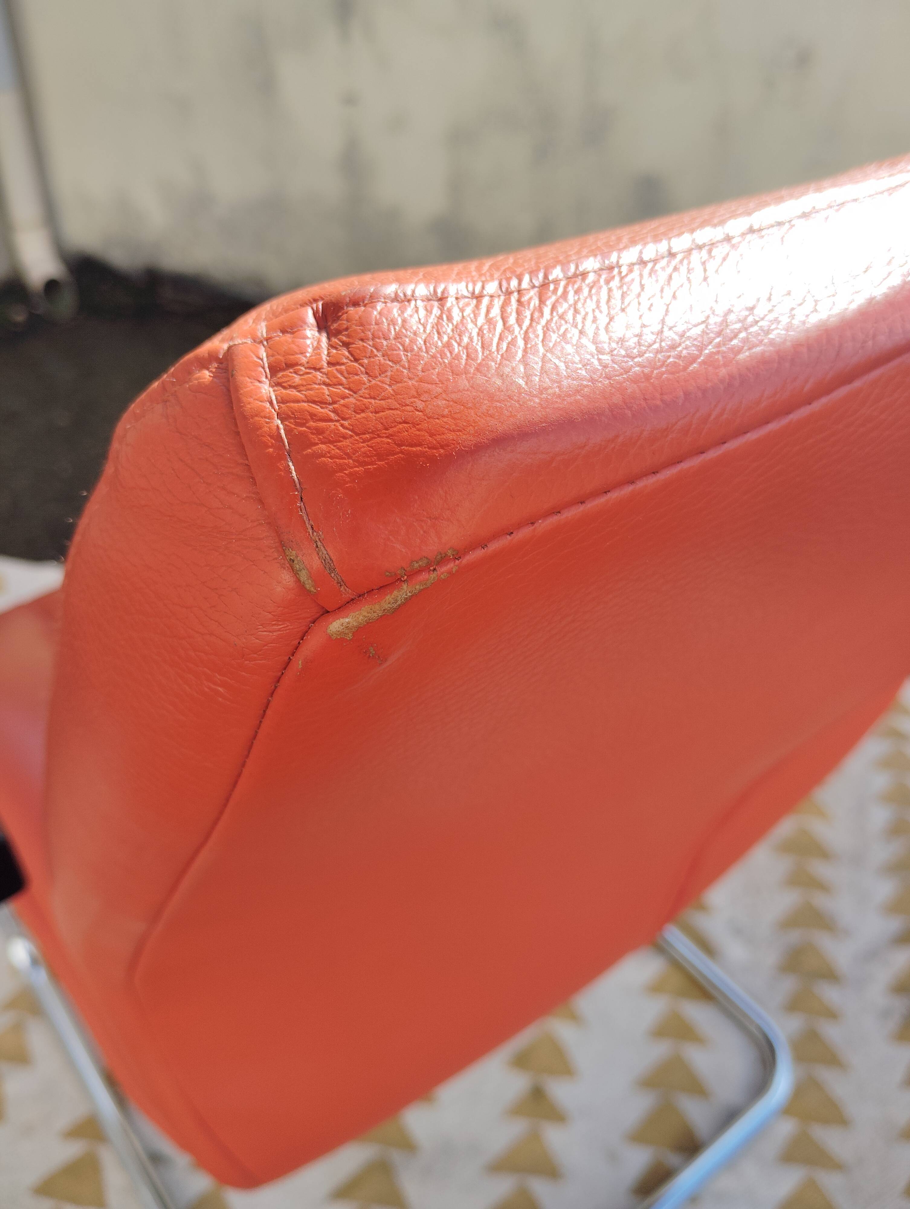 Orange leather cantilever tubular armchair