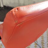 Orange leather cantilever tubular armchair