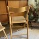Pair of folding wooden chairs and vintage cannage