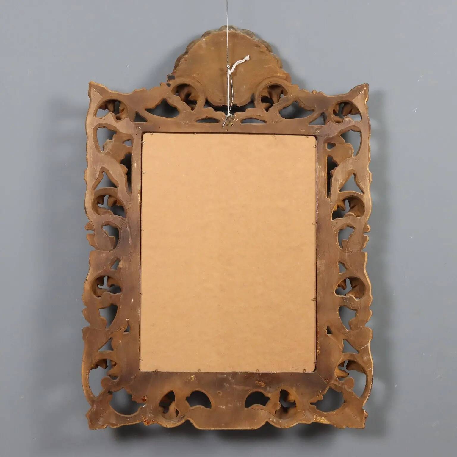 Antique baroque style mirror in carved wood, Italy, 20th century.