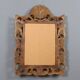 Antique baroque style mirror in carved wood, Italy, 20th century.