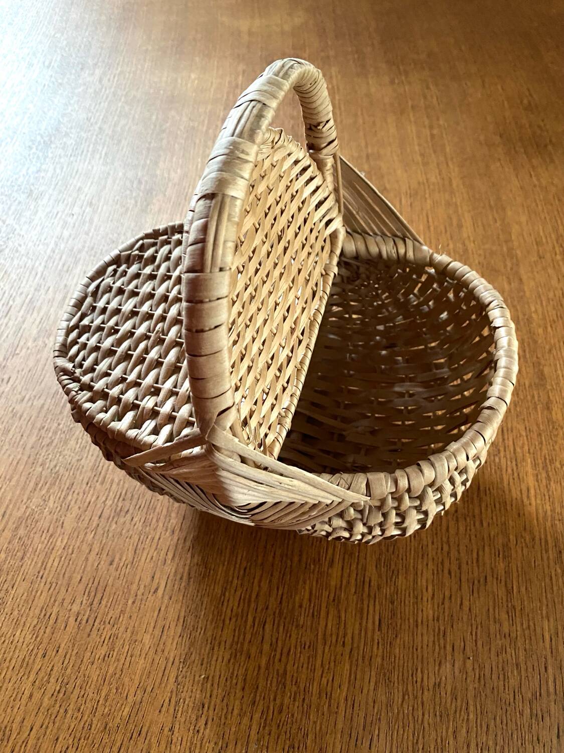 Handcrafted egg basket made of woven rattan and wicker