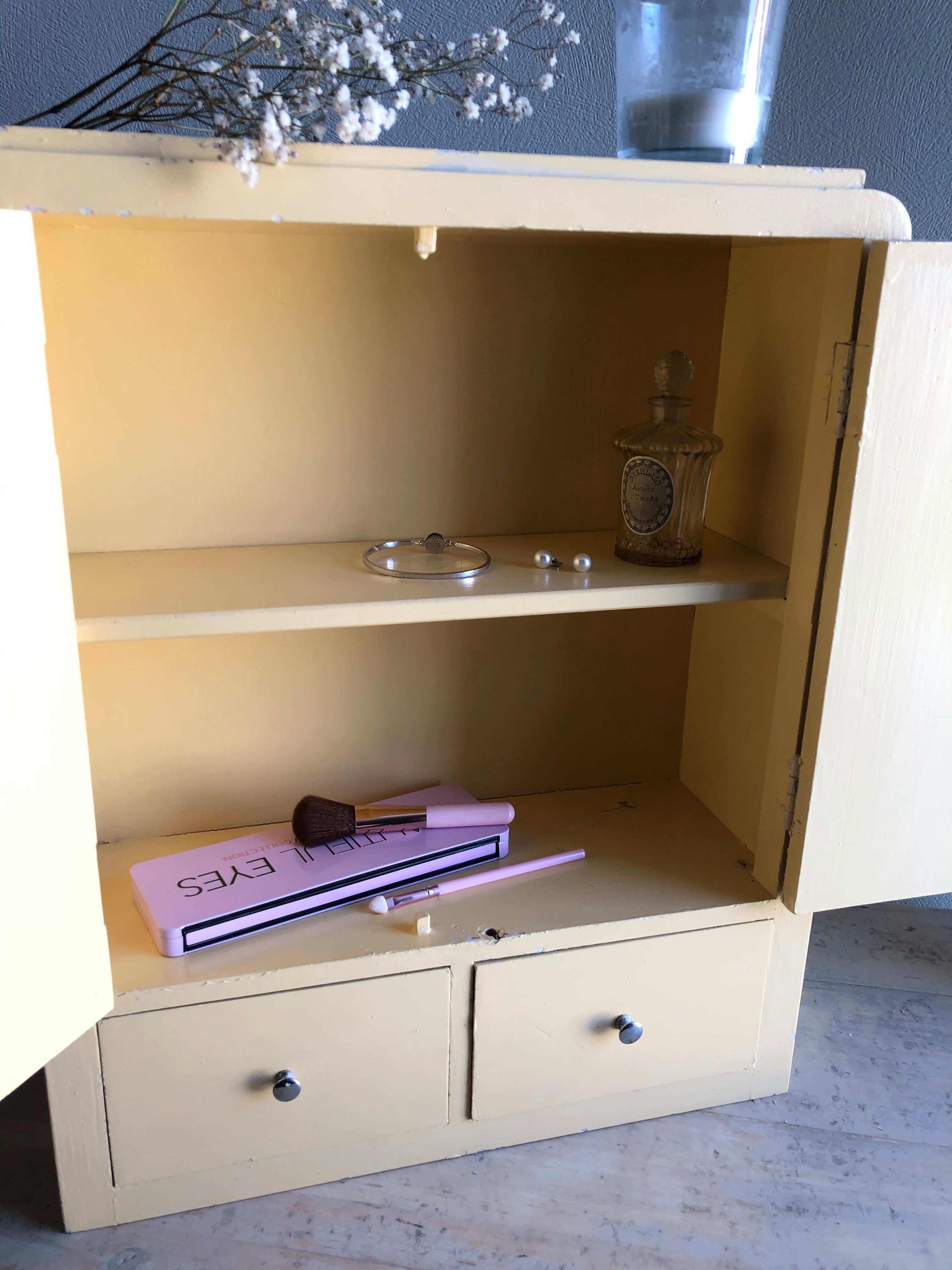 Weathered toilet cabinet