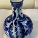 Glazed ceramic carafe with floral decoration