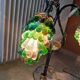 Bronze table lamp and Murano glass grape clusters.