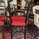 Set of four Napoleon III chairs in black lacquered wood with gold highlights.