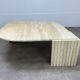 Table basse travertin forme œil par Roche Bobois