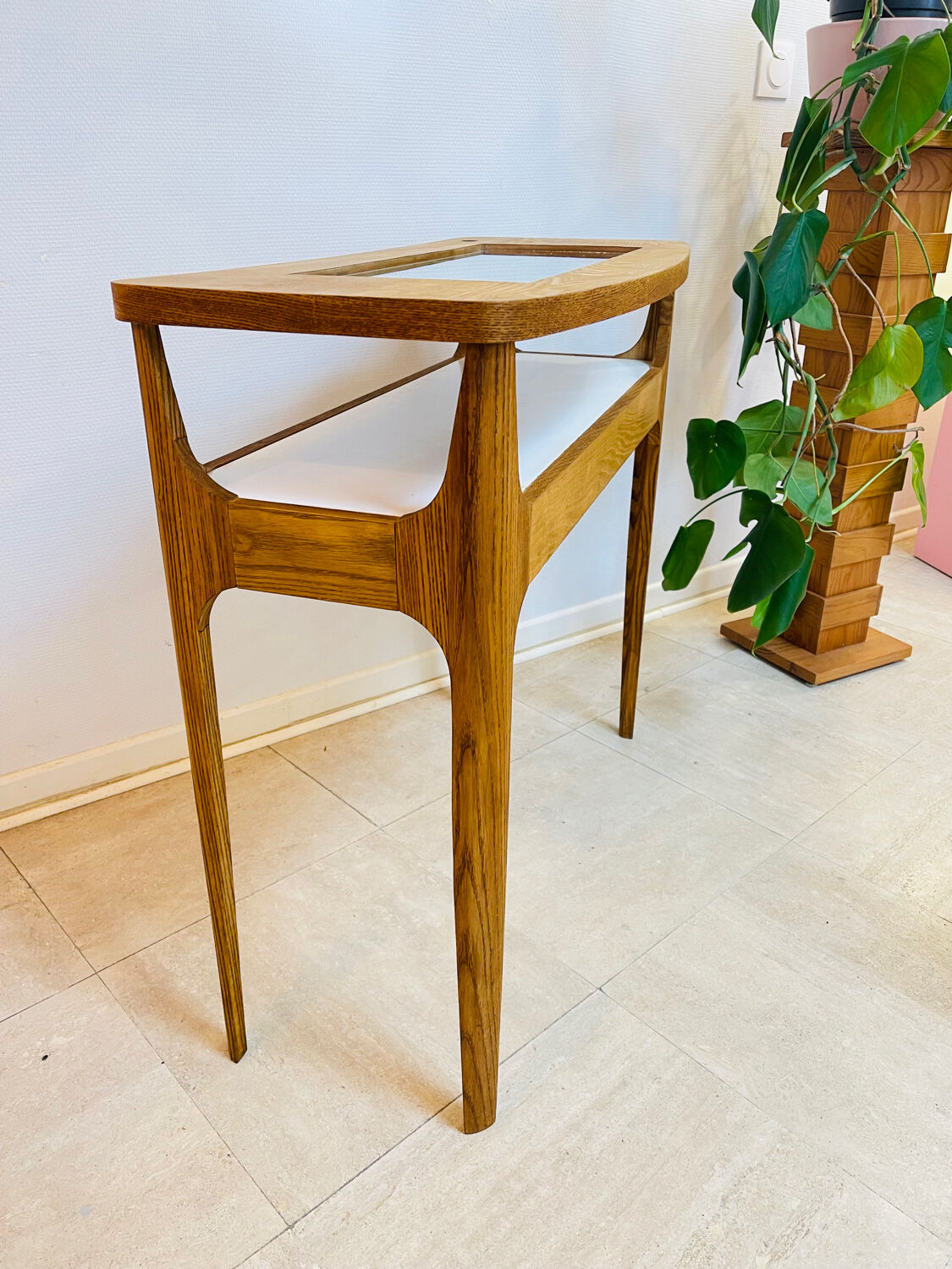 Small contemporary console in stained walnut wood.