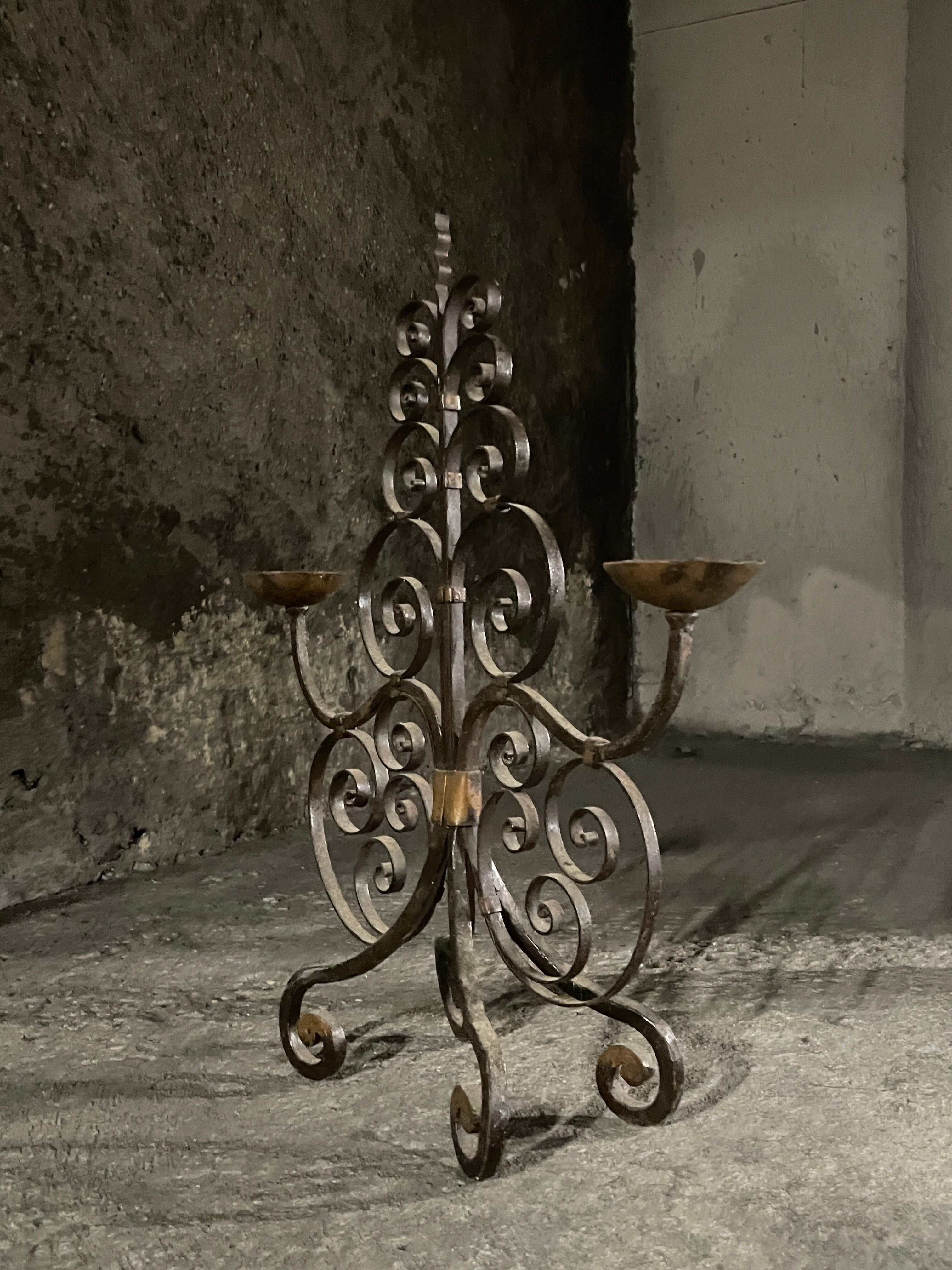 Pair of French wrought iron candelabra from the 19th century.