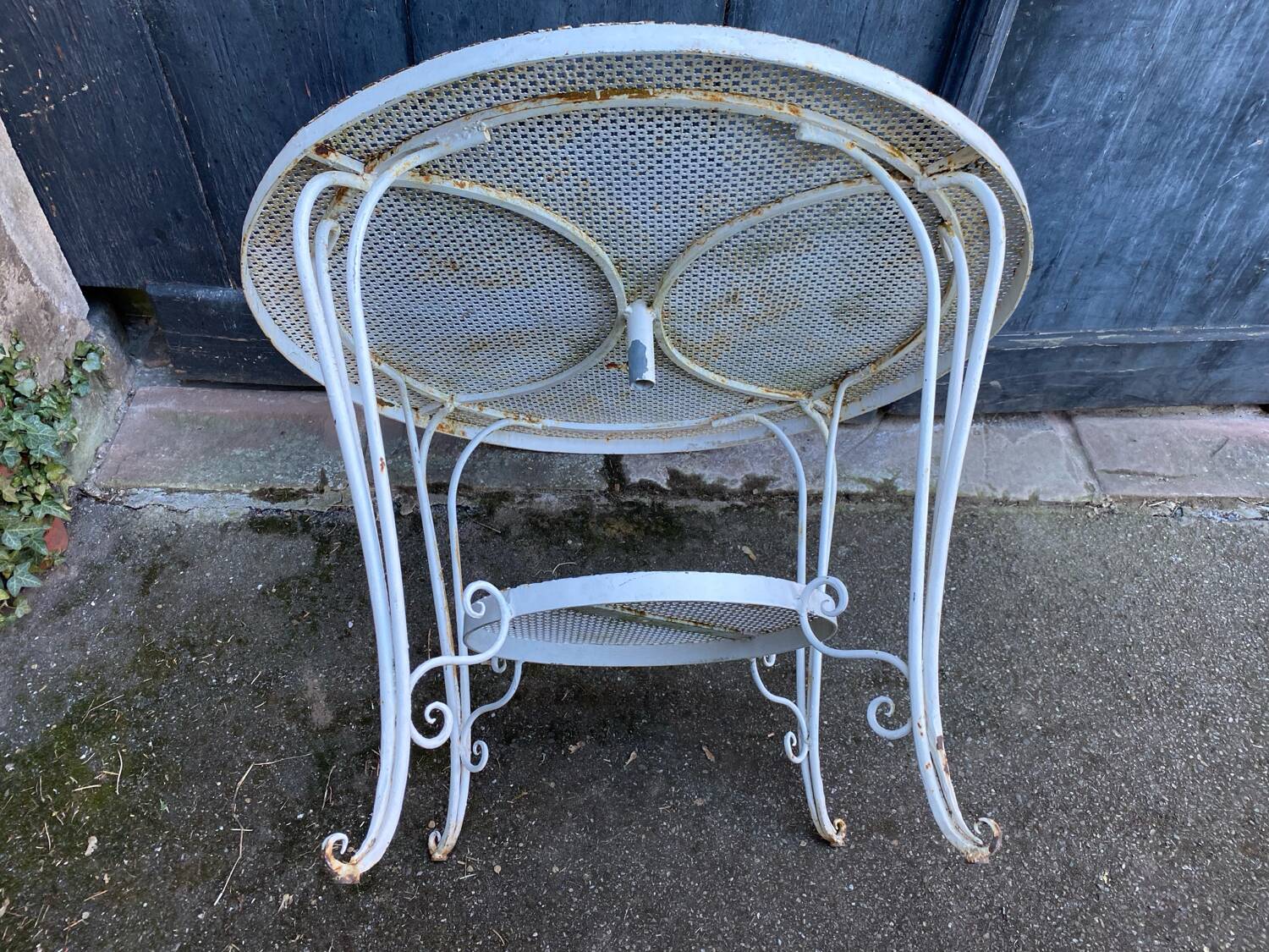 White lacquered perforated metal garden table circa 1950