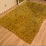 Large handmade wool rug from the 70s in lime green.