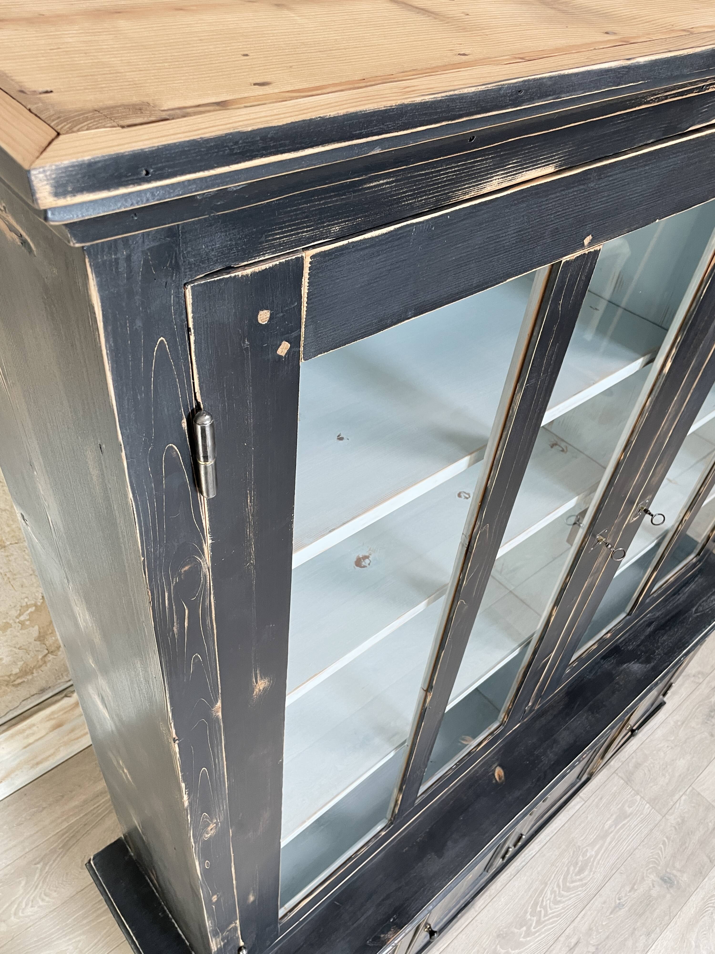 Display cabinet in patinated wood