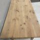 Large solid wood table with a sleek design – integrated storage.