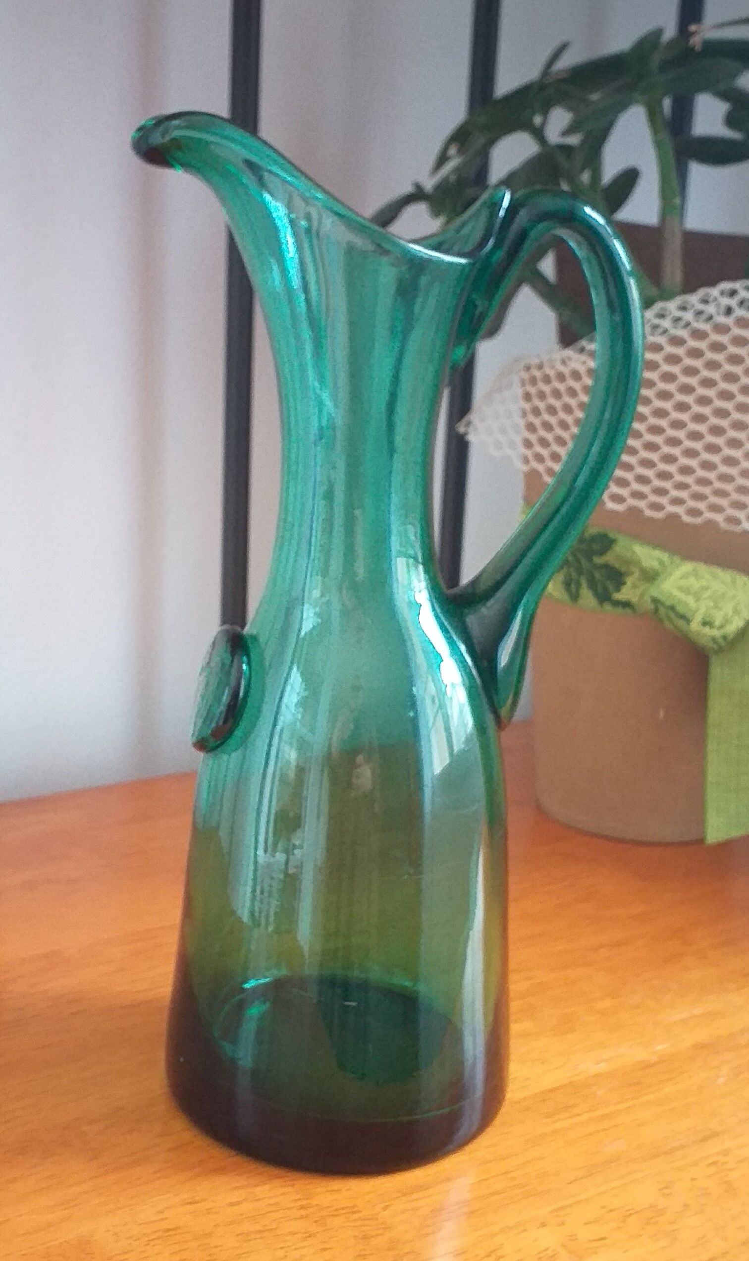Pitcher made of green glass blown and tinted in the mass