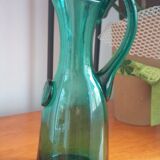 Pitcher made of green glass blown and tinted in the mass