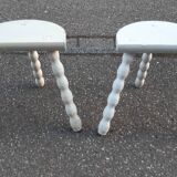 Duo of milking stools with turned legs.