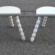 Duo of milking stools with turned legs.