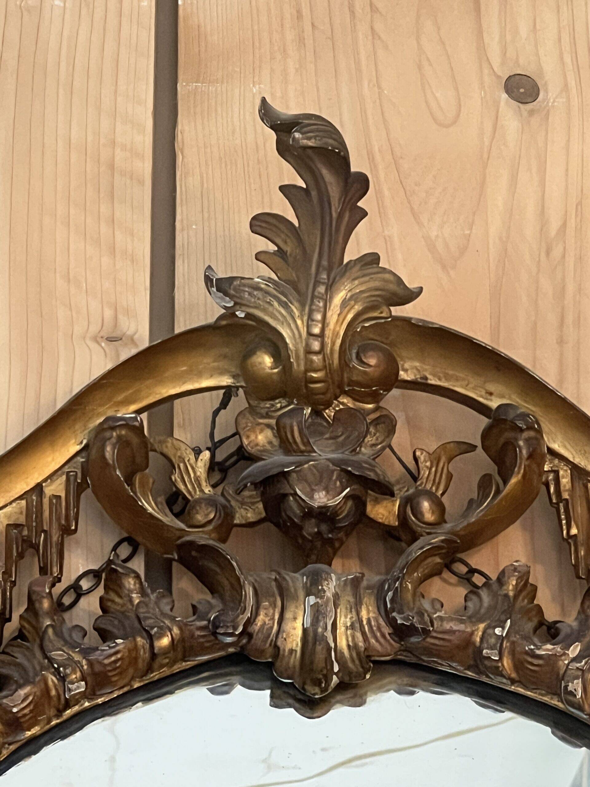 Large gilded wooden mirror, richly carved with winged dragons, 19th century