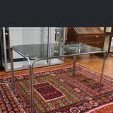 Vintage glass dining table with chrome legs.