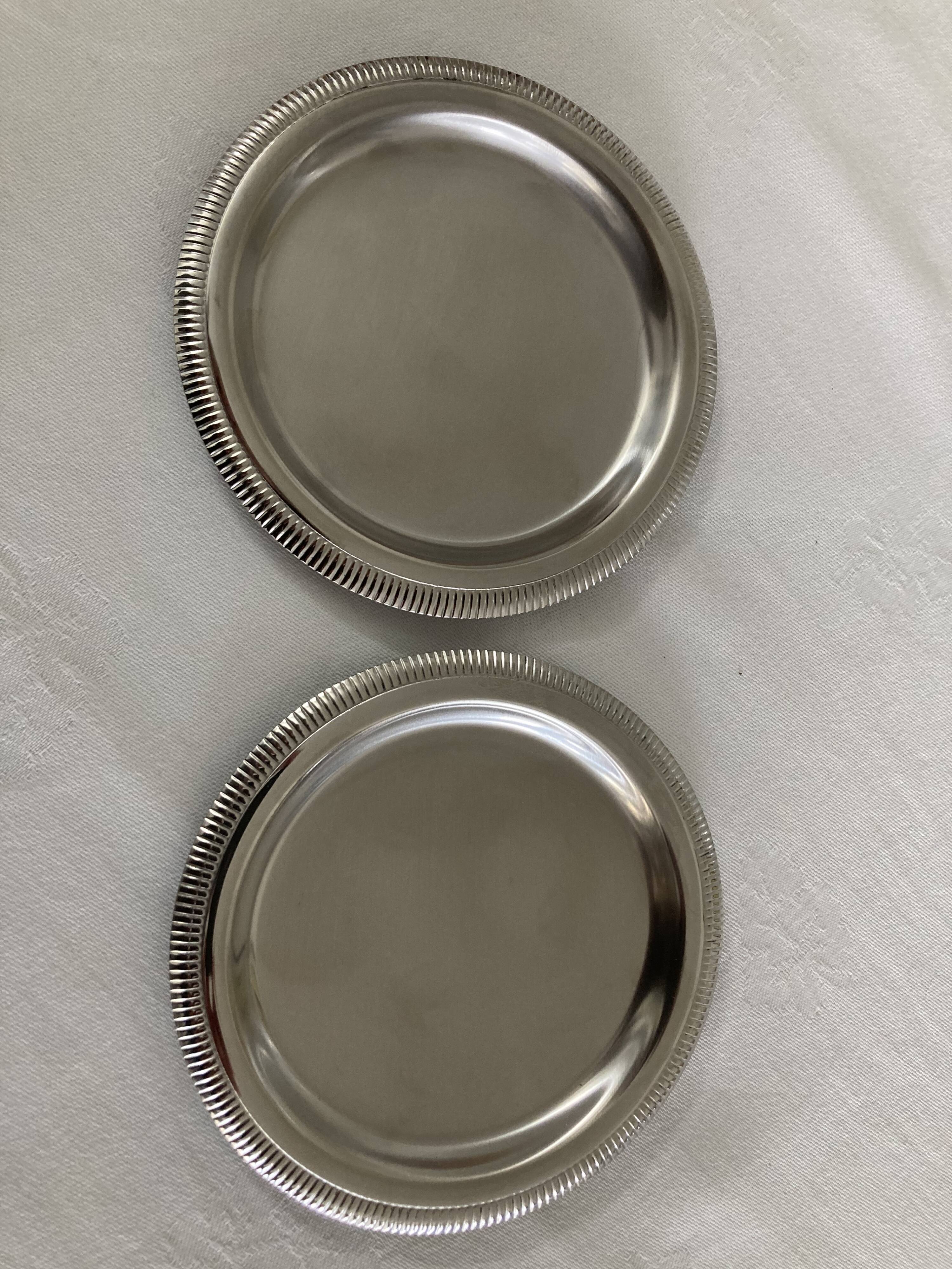 Pair of stainless steel bottle coasters létang and rémy