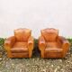 Paire de fauteuils club Moustache vintage cuir fauve