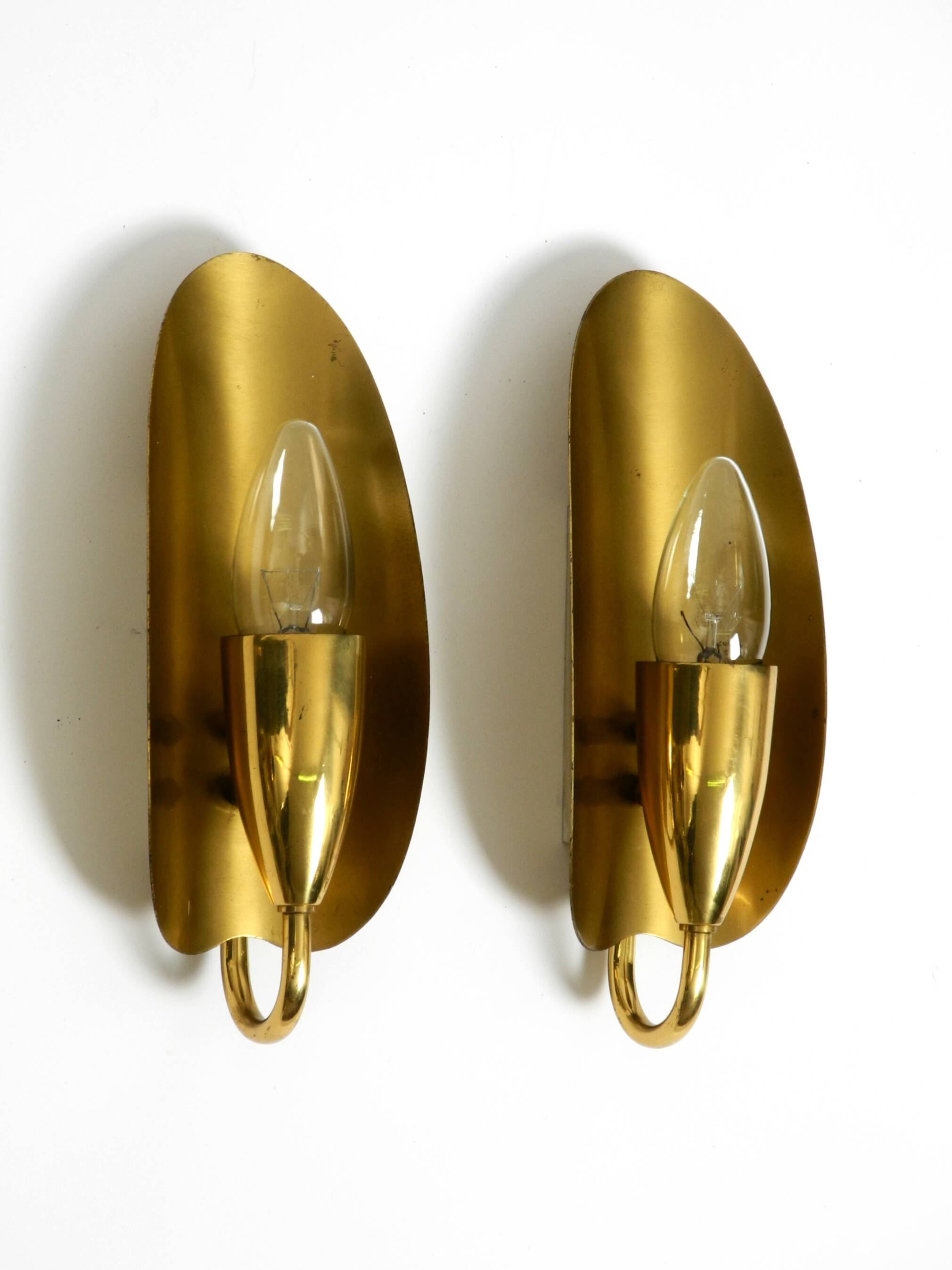 Two magical original Mid Century Modern bag brass wall lamps