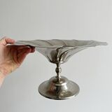 large dish on a shiny metal stand