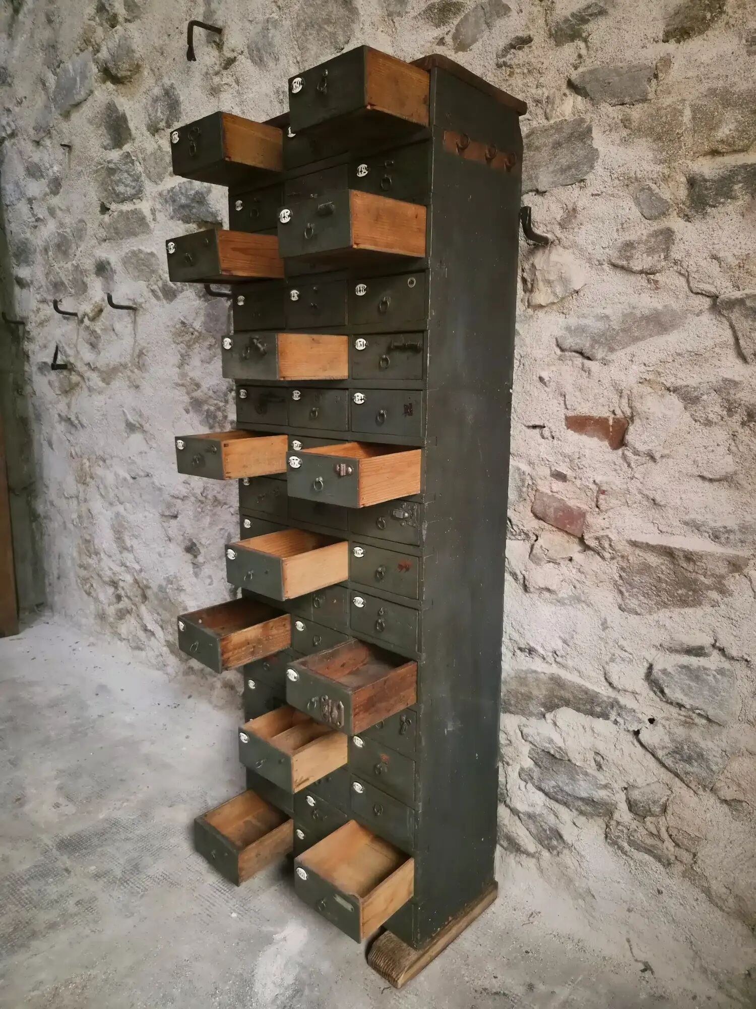 Antique hardware cabinet with 48 drawers, circa 1900.