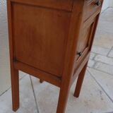 Antique bedside table with its marble top and white earthenware interior