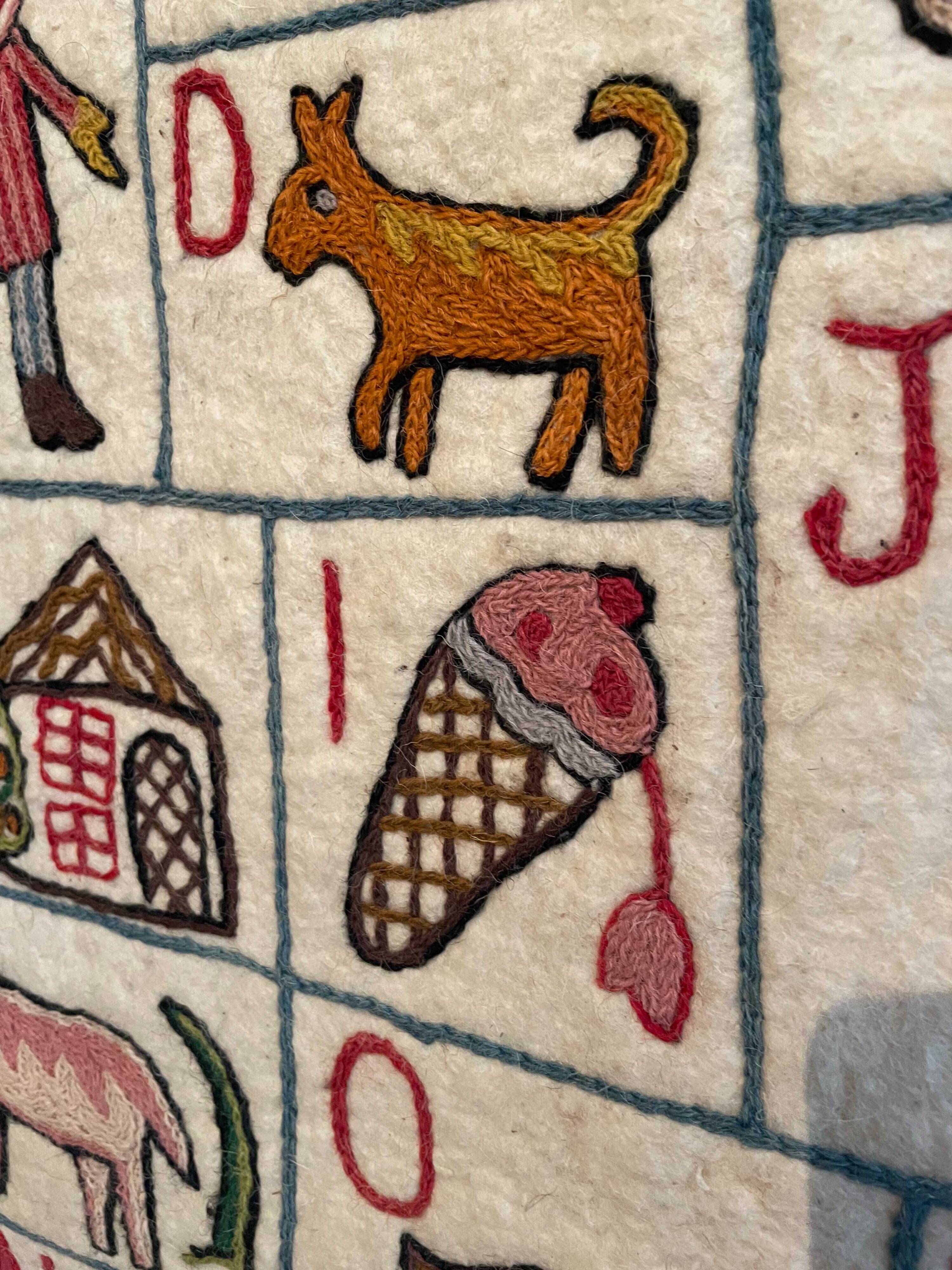 Vintage alphabet wall rug