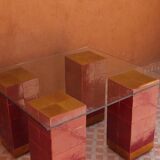 Modern coffee table in burgundy zellige with a tempered glass top.