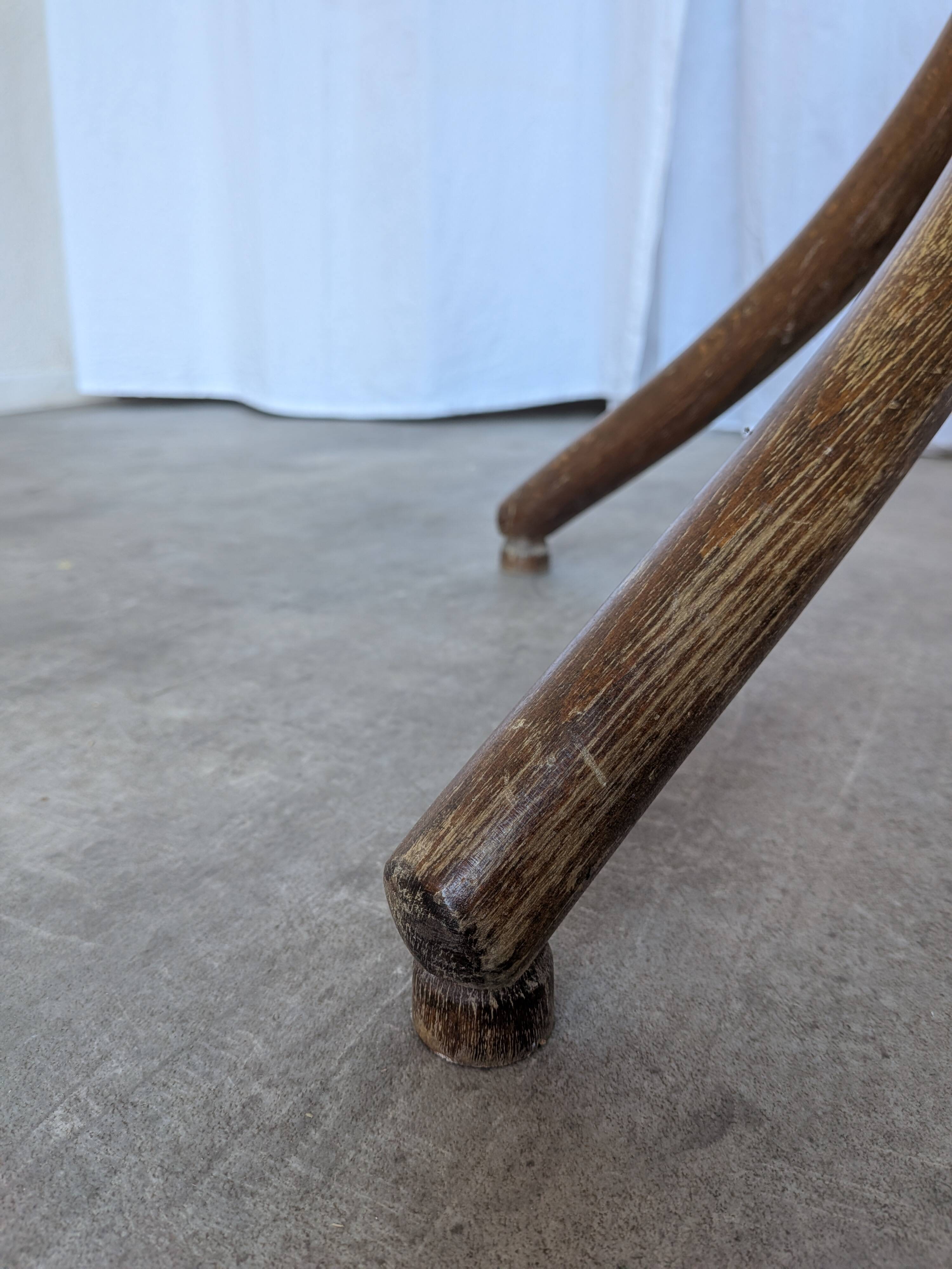Vintage bentwood coat rack in Thonet style / Dark wood coat rack with shadow.