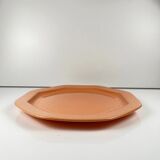 Octagonal plate in salmon pink, iron earth, Pagnossin, Italy, 20th century.