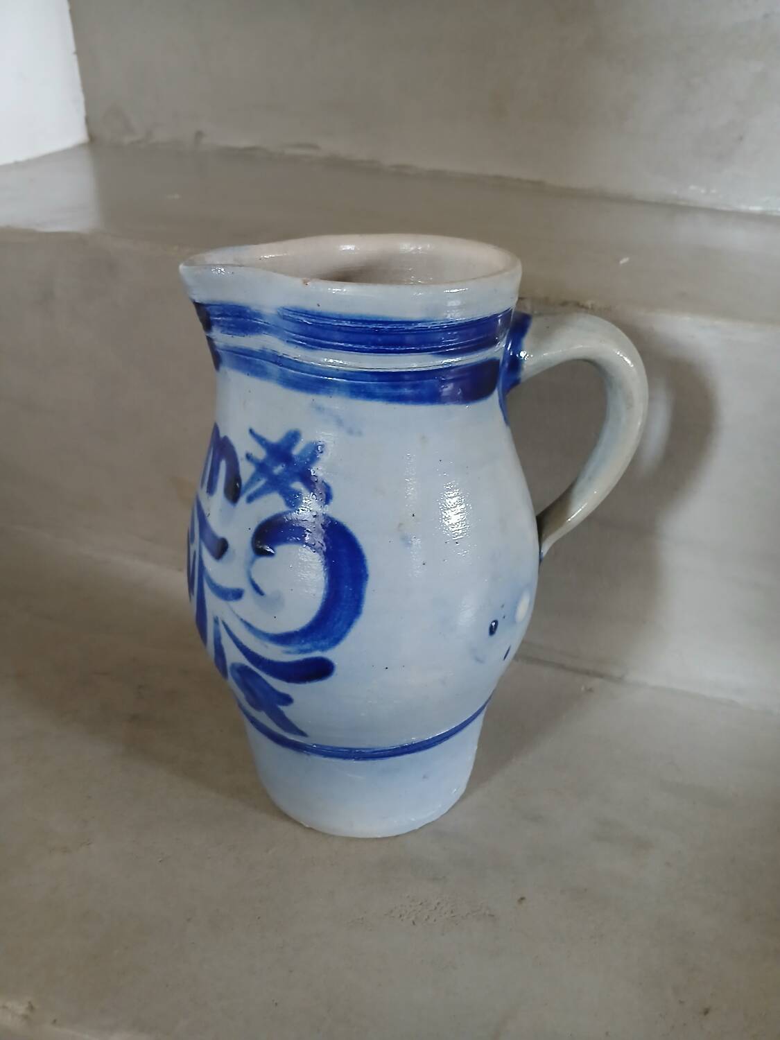 2 antique stoneware pitchers