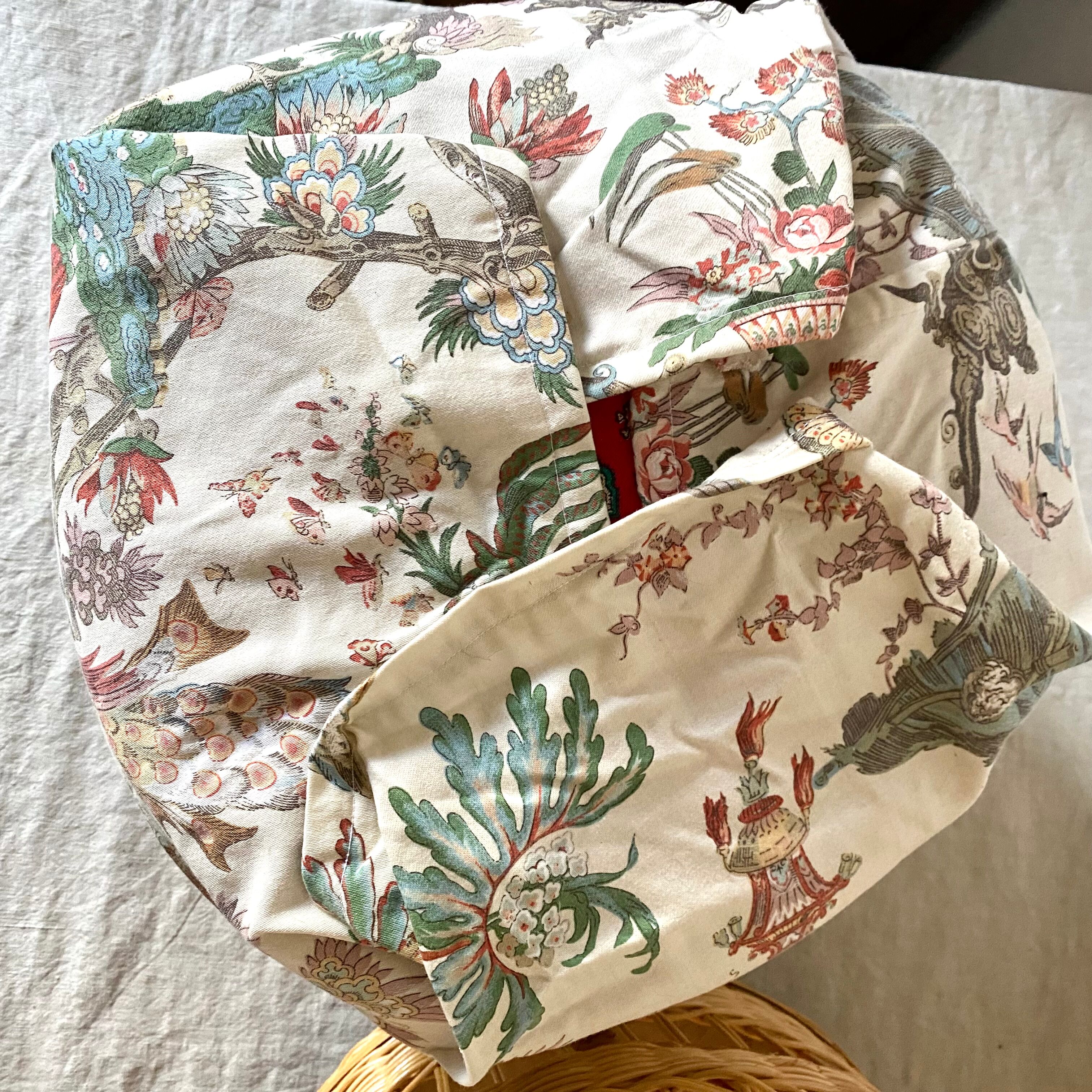 Rattan pouf and vintage fabric