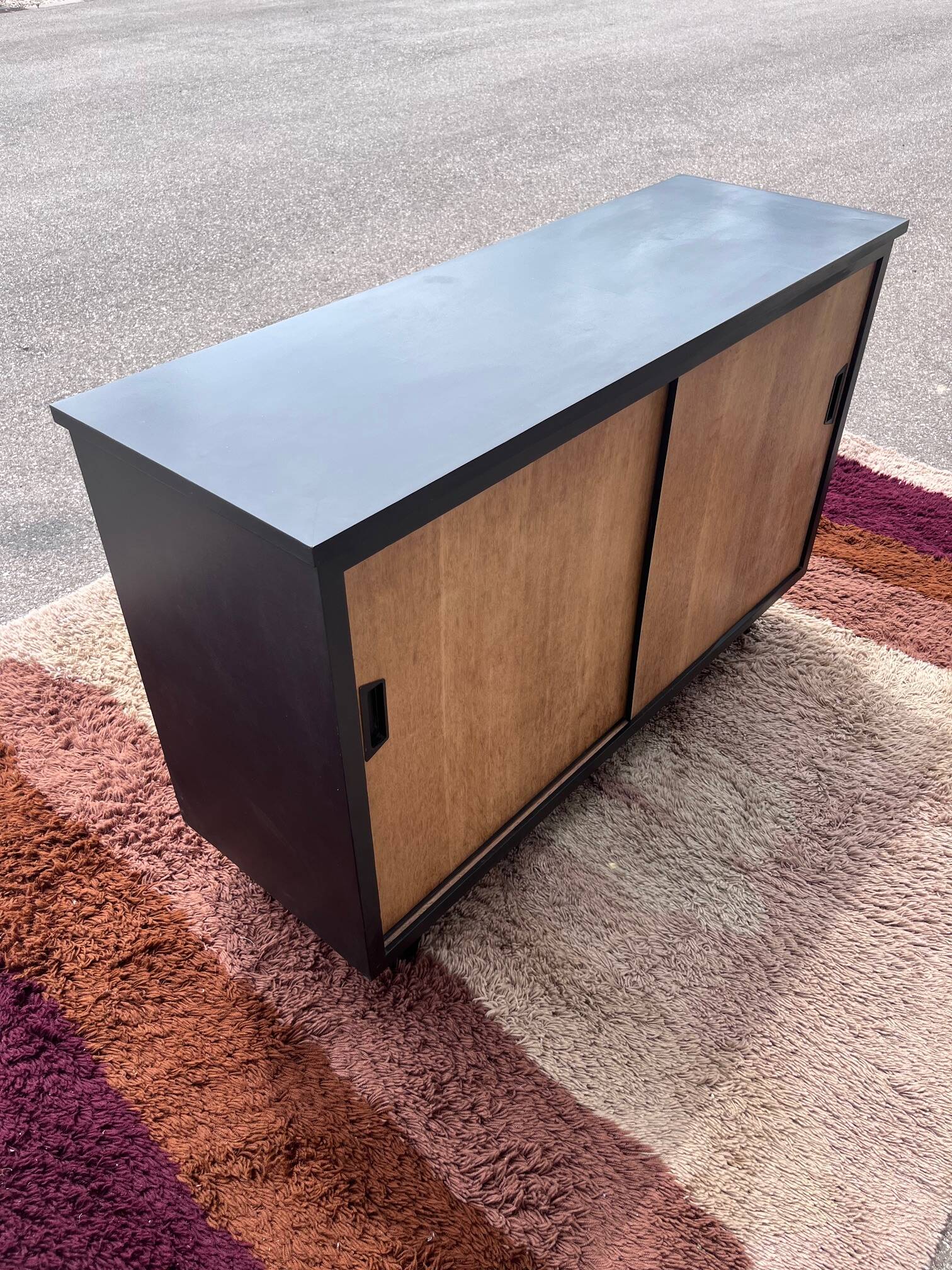 black and wood two-door sideboard