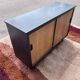 black and wood two-door sideboard