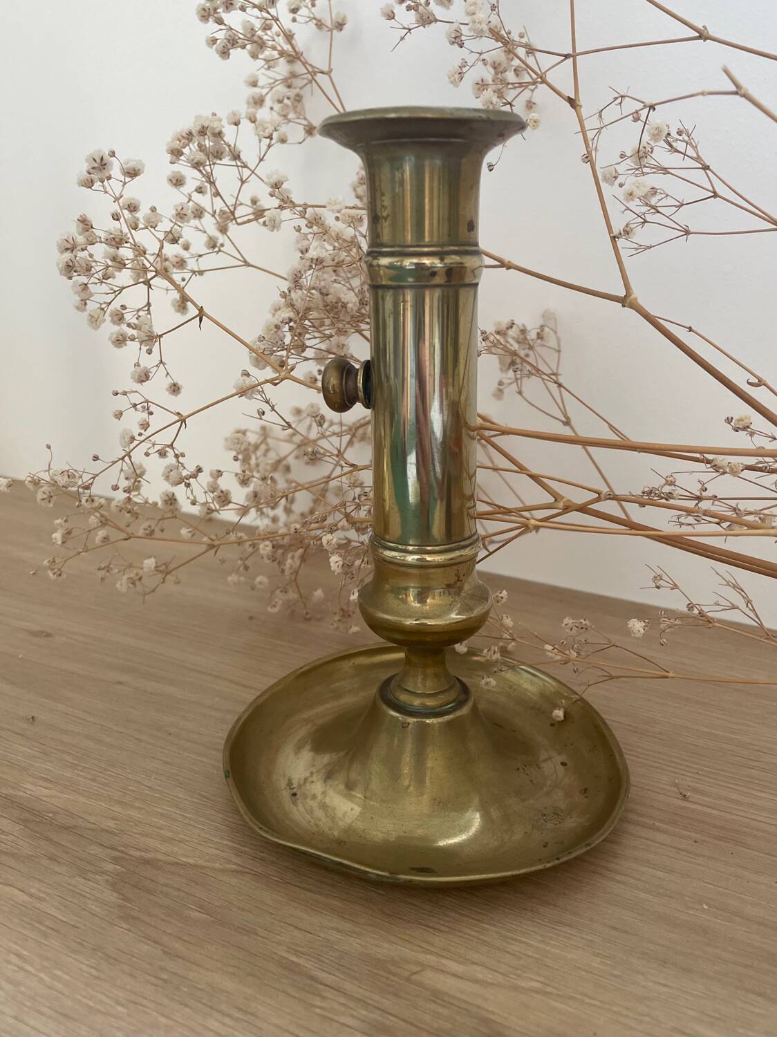 Brass candle holder with push button