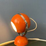 Orange mid-century space age eyeball table lamp