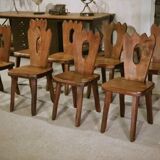8 chaises brutalistes en orme massif par Aranjou 1950’s
