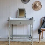 Antique wooden dressing table with marble top and mirror.