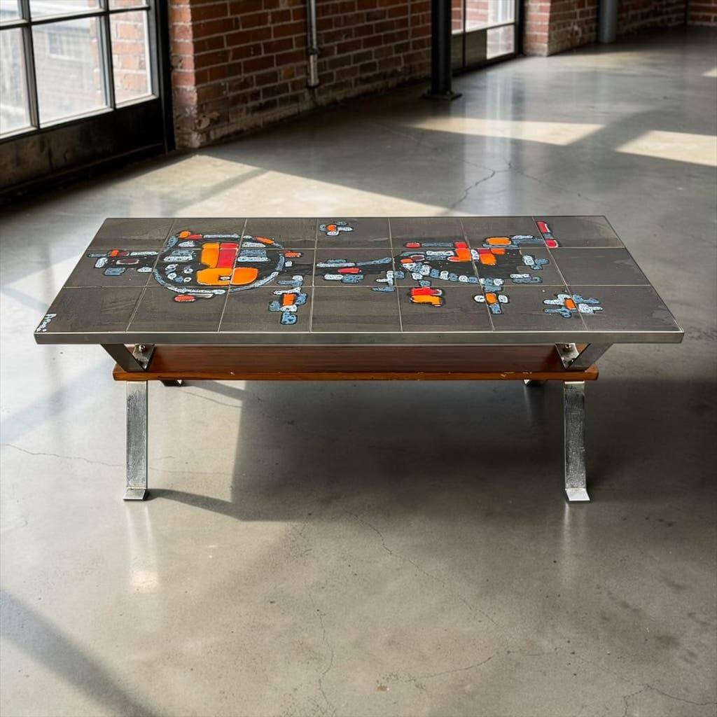 Vintage ceramic coffee table with chrome and wood accents.