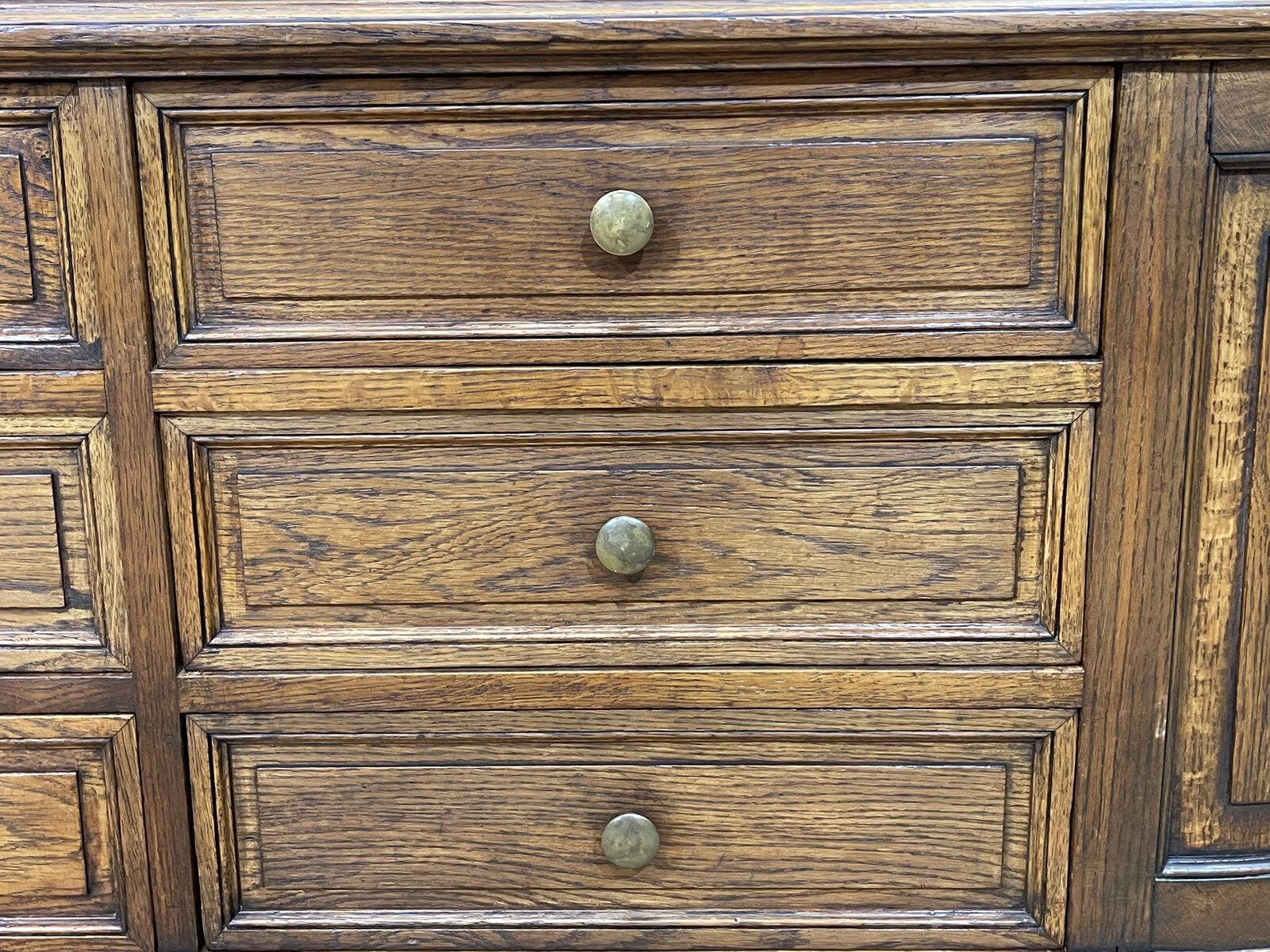 Long low oak countertop with 12 drawers - early XXth
