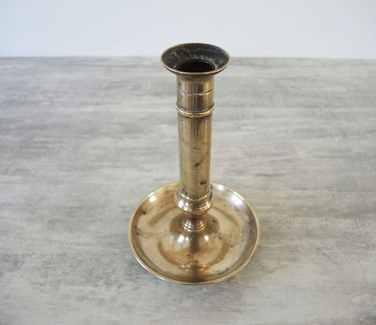 Old metal push candle holder