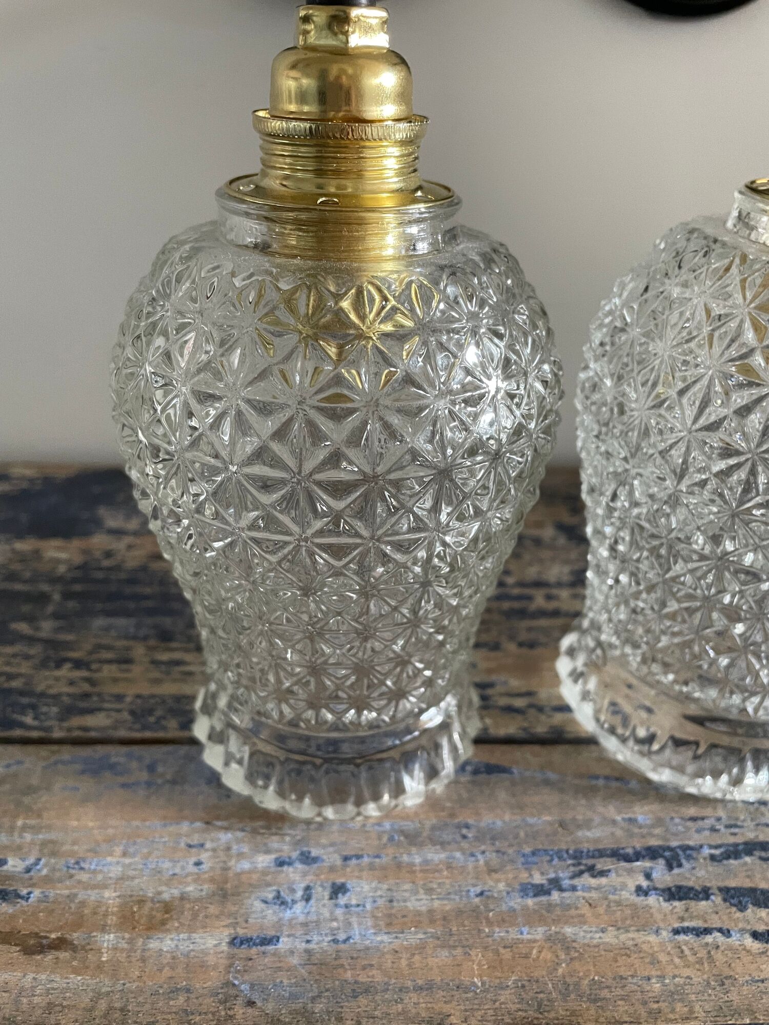 Pair of vintage electrified to nine-piece chiseled glass wall lamps