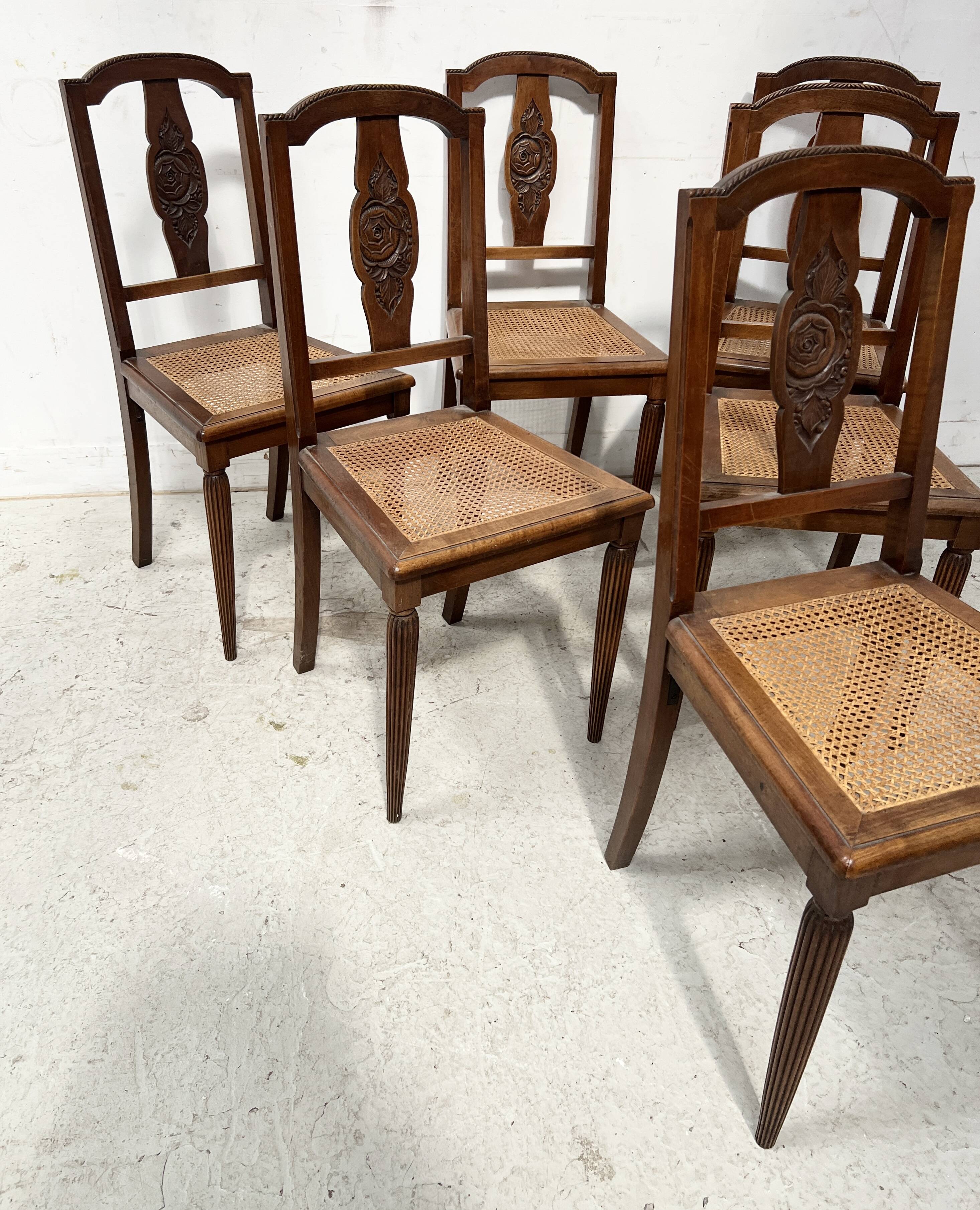 Set of six Art Deco chairs in solid walnut, 20th century.